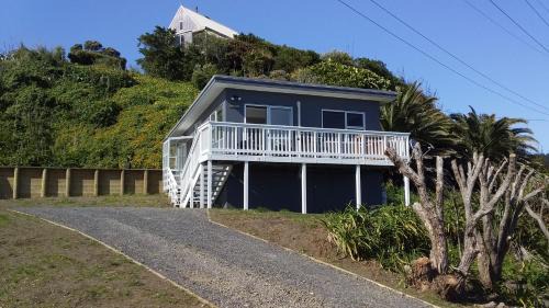 Raglan House | Karoro the beach front bach with views to die for!