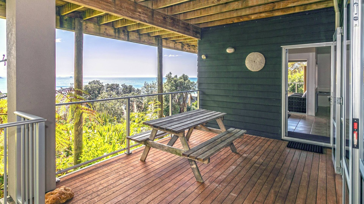 Tairua Apartment | Kick back and relax in this calm, stylish space.