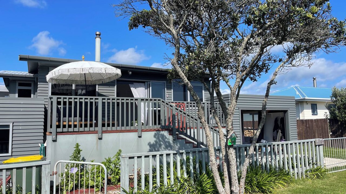 Pukehina House | Pukehina beach house: Estuary views + Outdoor bath