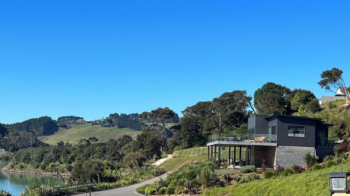 Raglan House | Rangitahi paradise. A modern 4 bedroom home overlooking the estuary in Raglan.
