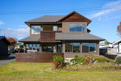 Wharewaka House | Spacious Family Retreat With BBQ, Across the Road from Lake