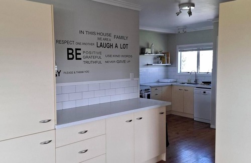 Ruakaka House | Beautiful Ruakaka beach fun, lots of space, 2 lounges, big garden