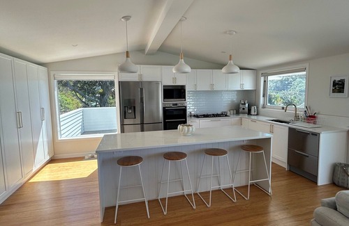 Oakura House | Beautifully renovated 5-bedroom bach just steps from the sand.