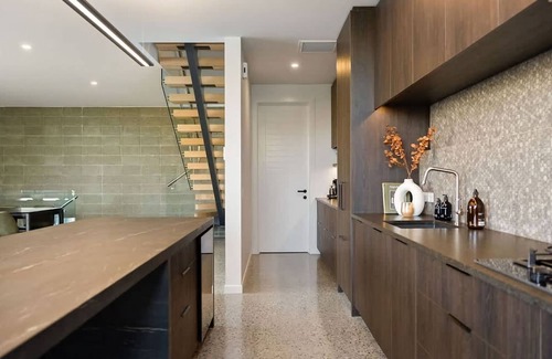 Frankton House | Elevated Elegance is a luxury retreat with dramatic views of the lake & mountains.