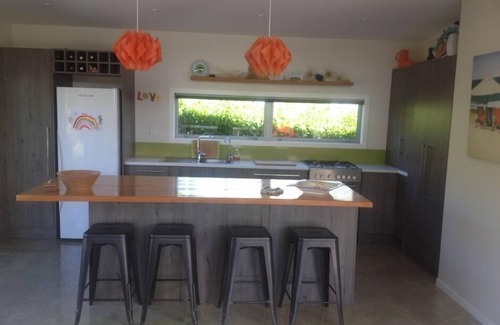 Whiritoa House | Family Friendly Modern Bach with Decks & Outdoor Fire, 200m from Beach/Surf Club