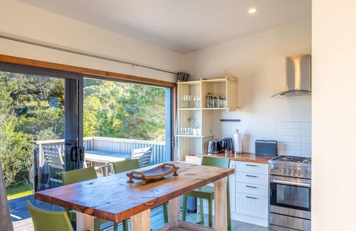 Onetangi Cottage | Harvest Cottage Onetangi - Peaceful 2-bedroom cottage with vineyard views and a paddock of grazing horses. 10-min walk to Onetangi Beach, close to top wineries and cafés. Two queen bedrooms, full kitchen, smart TV, heat pump, and sunny deck. Includes