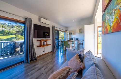Onetangi Cottage | Harvest Cottage Onetangi - Peaceful 2-bedroom cottage with vineyard views and a paddock of grazing horses. 10-min walk to Onetangi Beach, close to top wineries and cafés. Two queen bedrooms, full kitchen, smart TV, heat pump, and sunny deck. Includes
