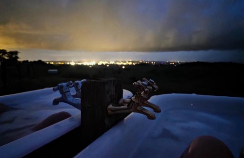 Karioitahi Villa | Historic Luxury Escape with Twin Outdoor Baths