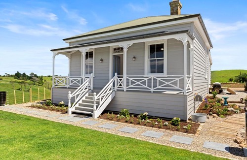 Karioitahi Villa | Historic Luxury Escape with Twin Outdoor Baths