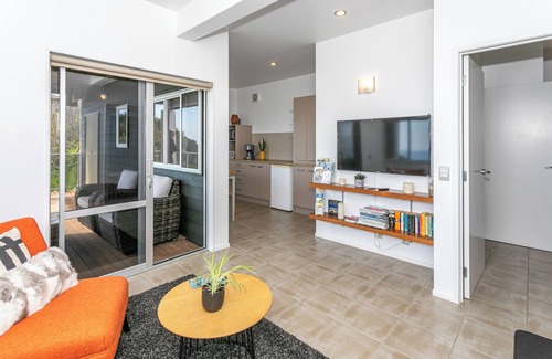 Tairua Apartment | Kick back and relax in this calm, stylish space.