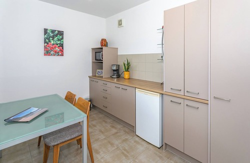Tairua Apartment | Kick back and relax in this calm, stylish space.
