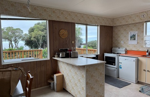 Parapara House | *NEW LISTING* Beachfront bach - your slice of paradise.