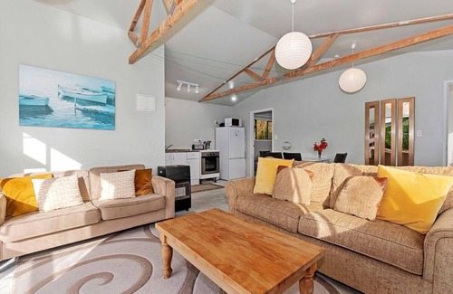 Mangawhai Heads House | Ocean Views - Modern, sunny, pet friendly holiday home only a short walk from the estuary