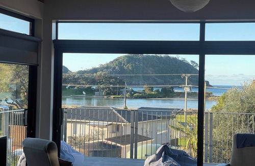 Matapouri House | Peaceful 4-Bedroom Beach House across road from estuary & fantastic beach views