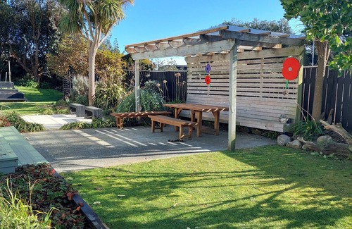 Waitarere Beach House | Pipers Place - 3 bedrooms, Sleeps 6, fully fenced home. Relax in the garden