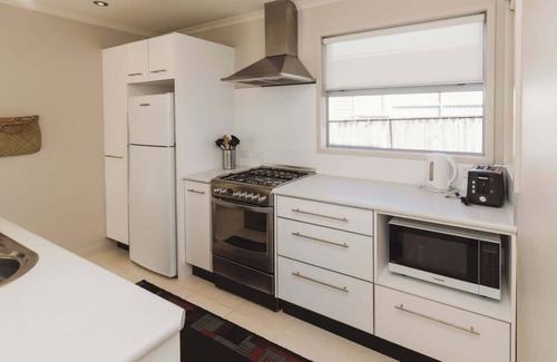 New Plymouth Apartment | Sail-Shaped Townhouse in New Plymouth