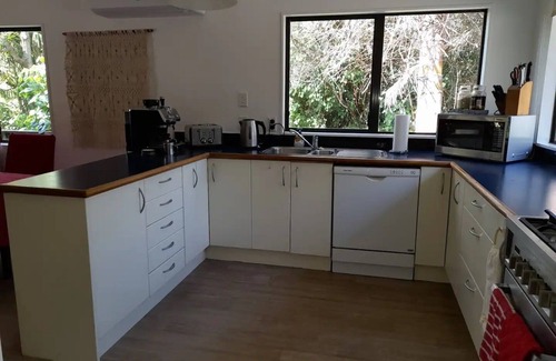 Waipapa House | Subtropical Hideaway: 1 acre Fenced gated property with caretaker studio 3 dogs