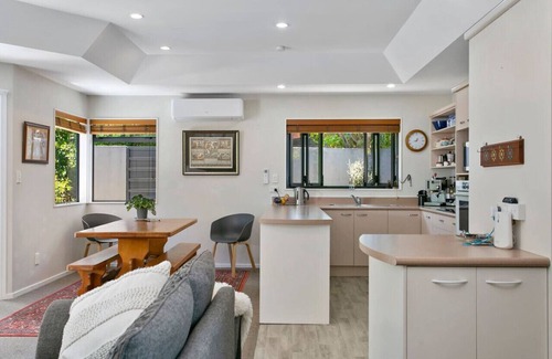 Waipahihi House | Treetop Living - peaceful oasis, serene and cozy interior, scenic views of native bush.