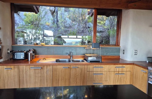 Motueka Valley House | Unique eco home; treehouse retreat.