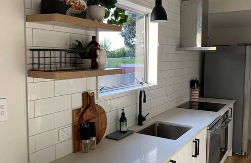 Waikanae House | Waikanae Beach Abode: Memories, Family & Relaxation