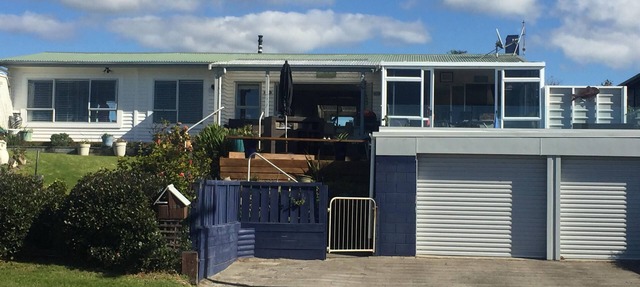 Lovely sunny home with beach views to the front and county views at the back.