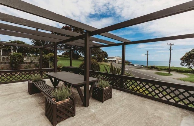 Stunning Waterfront Bach with Sea Views