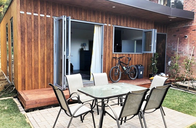 Warm modern retreat nestled by Rotorua’s Redwoods with cozy retro charm