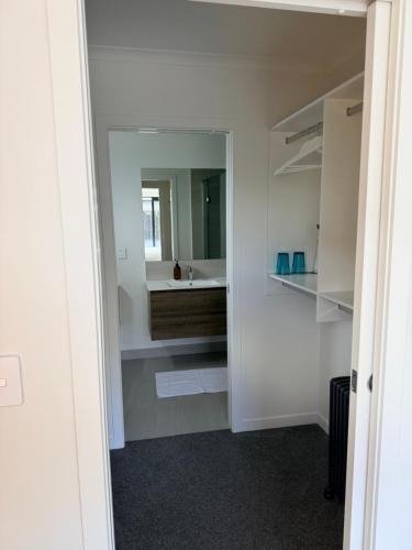 Hamilton House | Modern ensuite master bedroom in a shared home