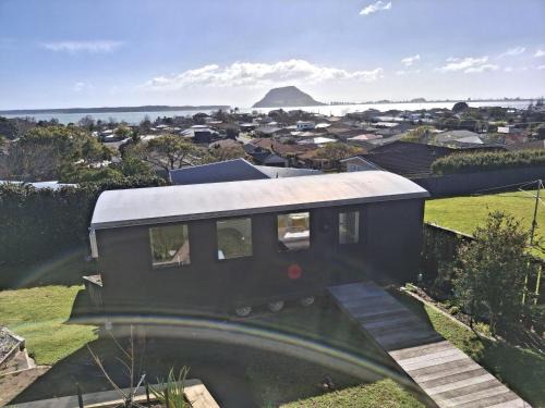 Otumoetai House | Award-Winning Railway Carriage - Sea & Mount Views