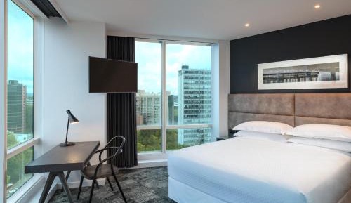 Corner Room with King Bed and City View