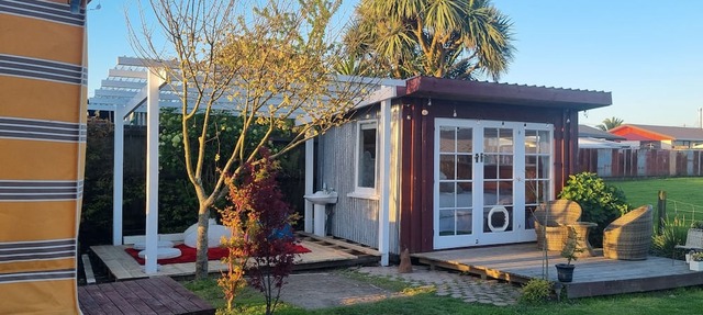 Unique, delightful Tiny Home with Alfresco living area including retro Poptop.