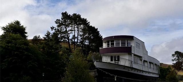 Romantic Getaway Accommodation on a World War II Ship near Waitomo Caves, North Island