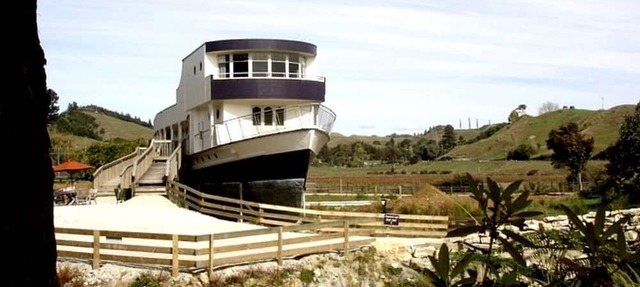 Renovated Historical WWII Ship on Land in Waitomo, New Zealand