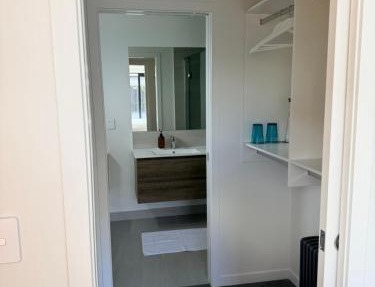 Modern ensuite master bedroom in a shared home
