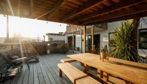 Waterfront location with estuary outlook and ocean beach access - sleeps 19